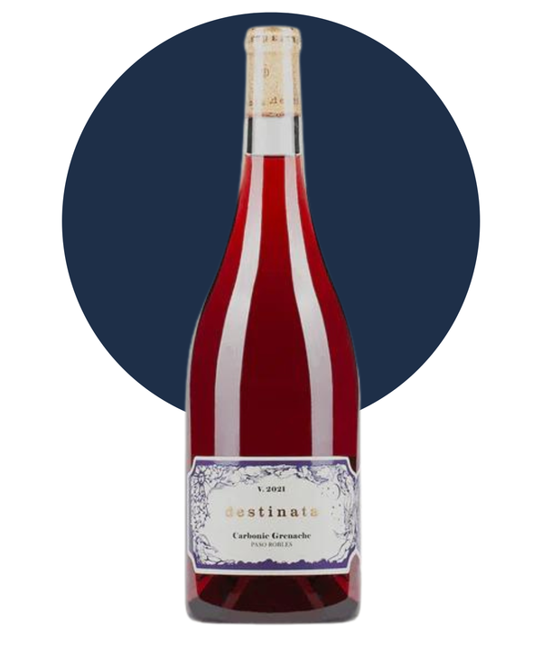 Bottle of Desinata Carbonic Grenache on white background with a dark blue circle