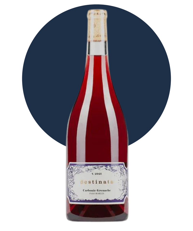 Bottle of Desinata Carbonic Grenache on white background with a dark blue circle