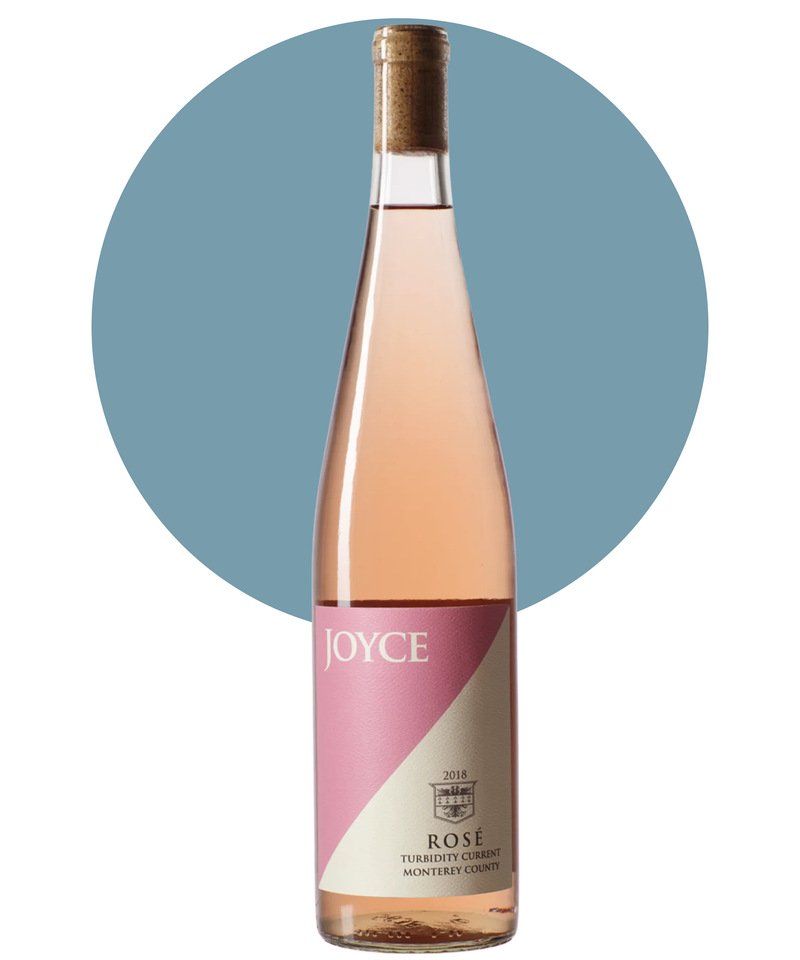 Bottle of Joyce Rosé on a white background with a light blue circle