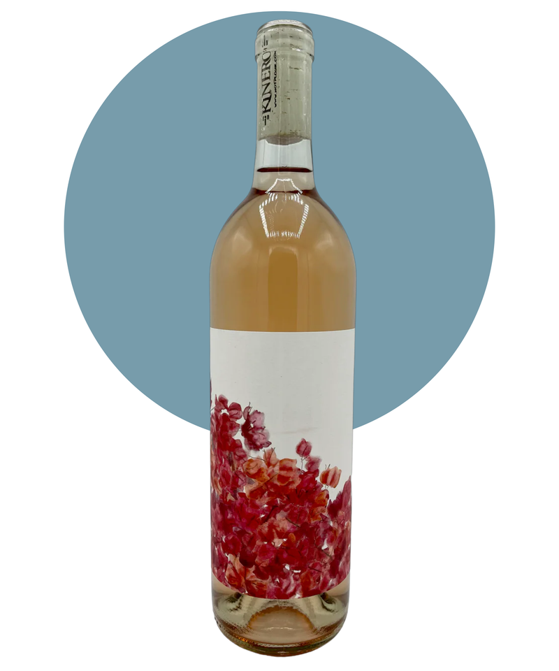 Bottle of Kinero Rosé of Grenache on a white background with a light blue circle