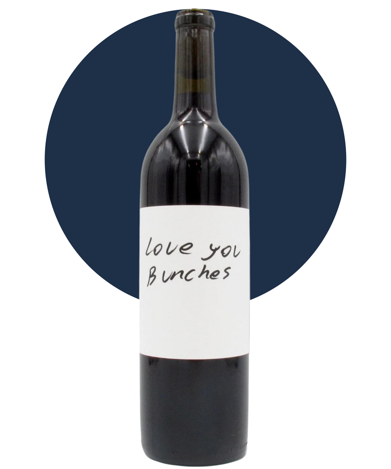 Bottle of Love You Bunches Carbonic Sangiovese on a white background with a dark blue circle