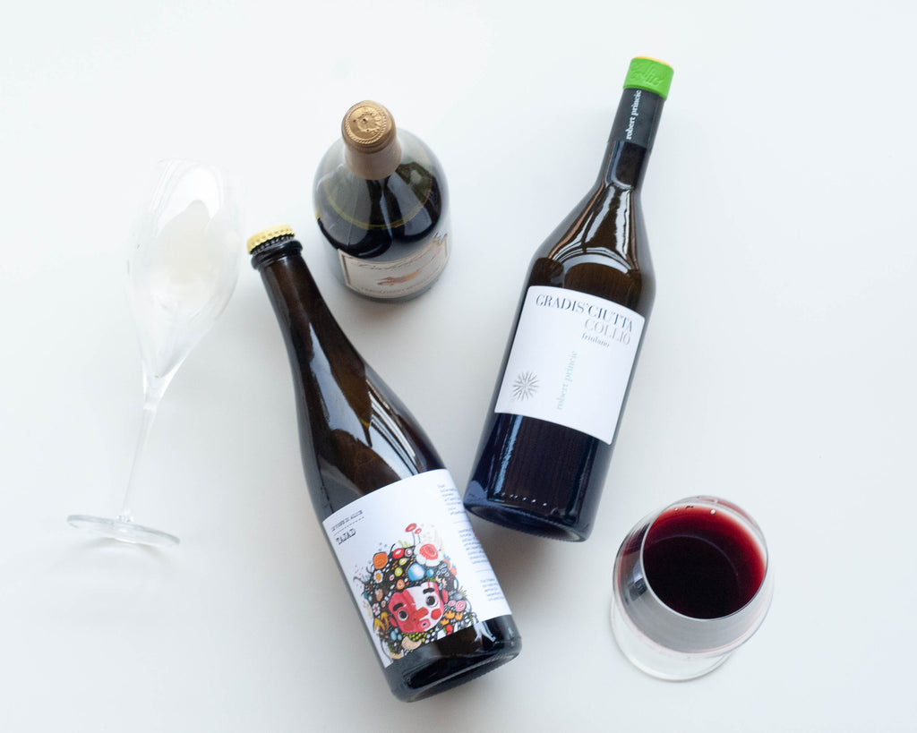 Flay lay of wine bottles - Italian wines a glass of red wine and a glass of sparkling wine